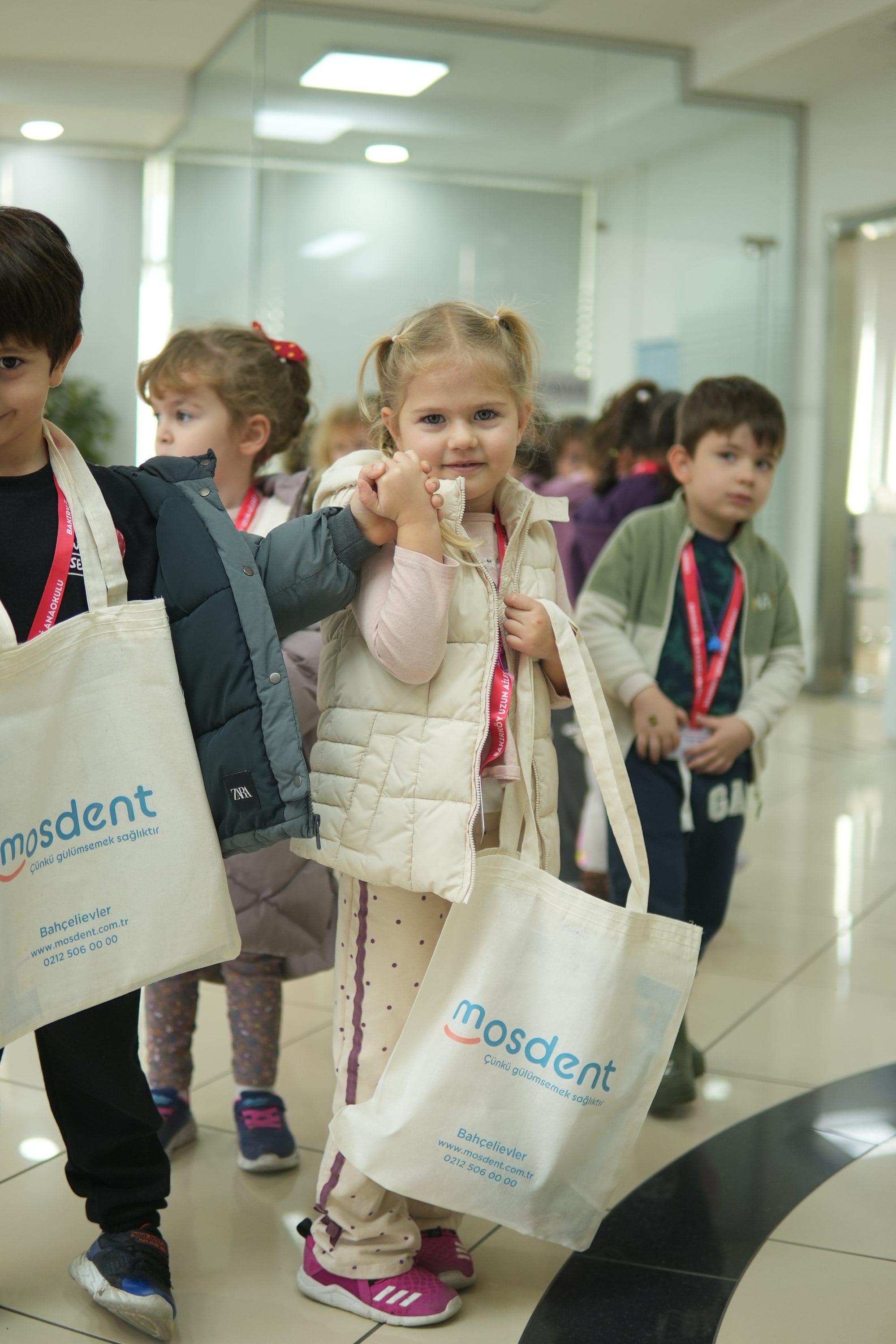 Children visiting Mosdent, holding their Mosdent bags